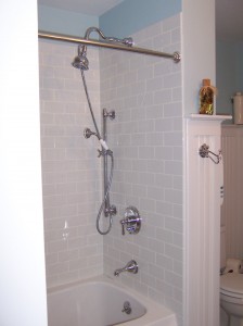 New subway tile shower and Victorian fixtures.