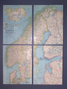 A vintage map cut, framed and displayed in simple glass clip frames